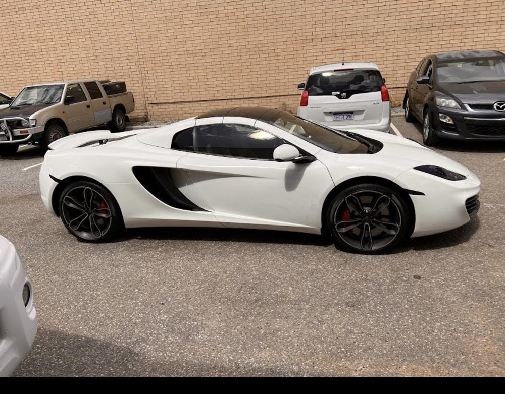 White McLaren outside the Malaga workshop